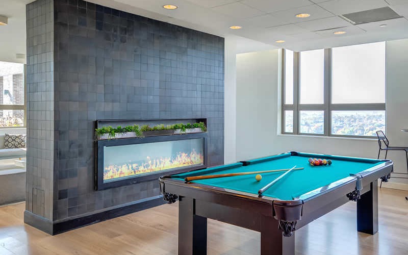 penthouse lounge with fireplace and pool table