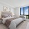 picture windows in bright bedroom