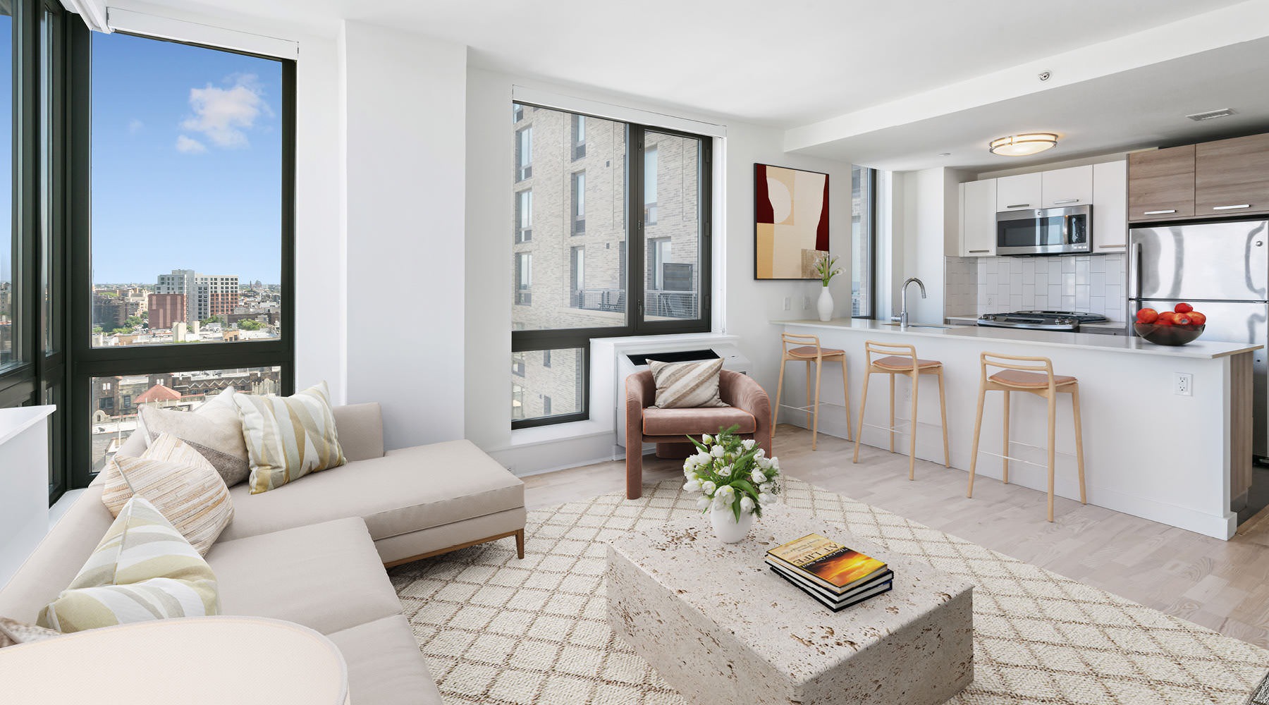 sun filled living room open to kitchen